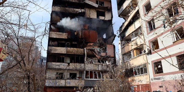 A residential multi-story building becomes damaged after a Russian missile struck it in southeastern city of Zaporizhzhia, Ukraine, on March 22, 2023. 