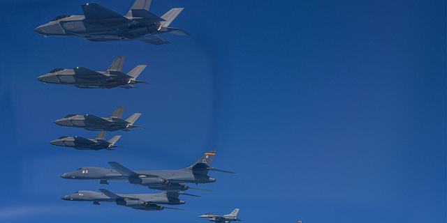 In this photo provided by the South Korean Ministry of Defense, US Air Force B-1B bombers (bottom left) fly in formation with South Korean Air Force F-35A fighters and South Korean F-16 fighters. The US Air Force (bottom right) over the South Korean peninsula during a joint air exercise in South Korea, Sunday, March 19, 2023. 