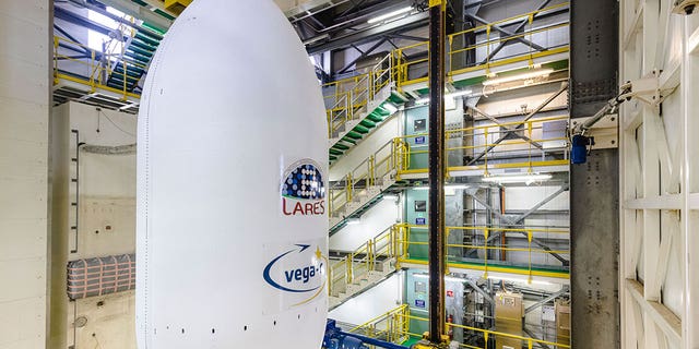 The Vega-C rocket is assembled to the launcher's nose cone at Kourou, French Guiana, on July 12, 2022. 