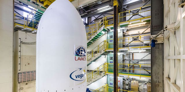 The Vega-C rocket is assembled to the launcher's nose cone at Kourou, French Guiana, on July 12, 2022. 