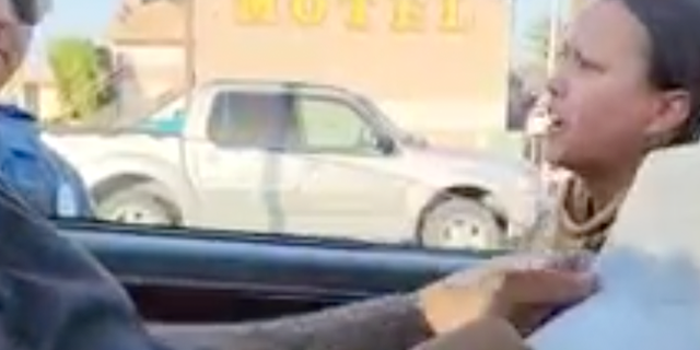 The owner of The Green Seed yells at a trooper in Washington state.