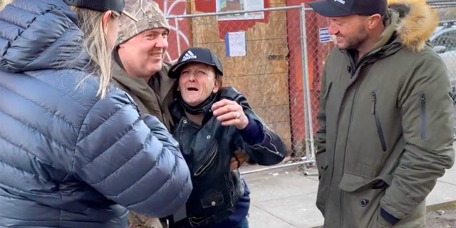 Wendy, center, cries with joy at the sight of her siblings who surprised her in Portland, Oregon, earlier this year.