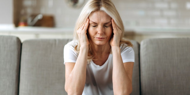 Woman with migraine