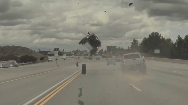Car flips on Los Angeles freeway after tire pops off pickup truck, video shows