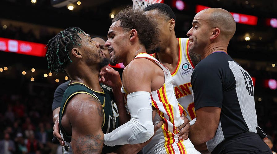 Celtics' Marcus Smart, Hawks' Trae Young get into wrestling match ...