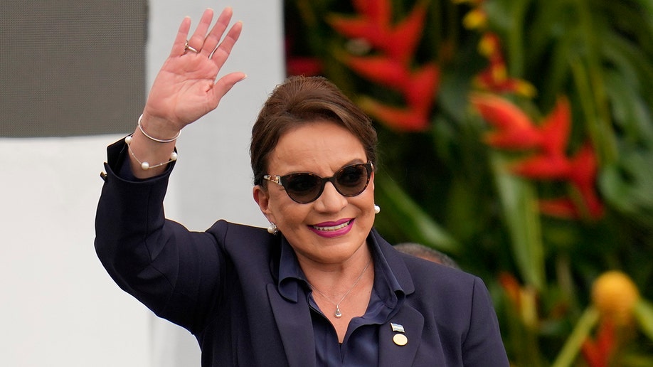 Honduras president waves