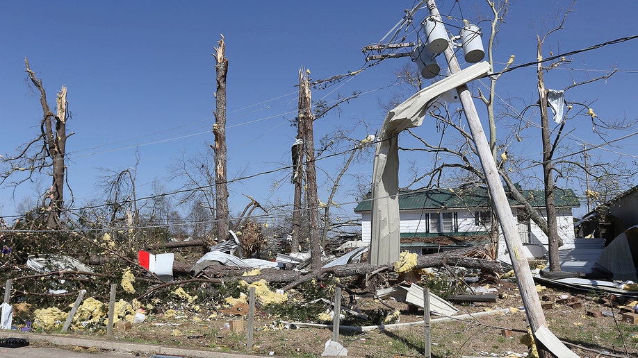 downed power lines and wrecked home