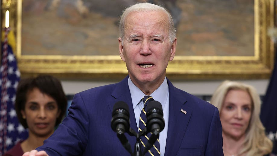 President Joe Biden speaks into a mic at a podium during appearance at White Houe