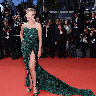 Sharon Stone at the screening of "Crimes Of The Future" in a green strapless dress with a high slit and long train