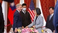 In this photo released by the Taiwan Presidential Office, House Foreign Affairs Committee Chairman Michael McCaul, R-Texas, left, and Taiwan's President Tsai Ing-wen, speak at a luncheon during a visit by a Congressional delegation to Taiwan in Taipei, Taiwan, Saturday, April 8, 2023. China sent warships and dozens of fighter jets toward Taiwan on Saturday, the Taiwanese government said, in retaliation for a meeting between the U.S. House of Representatives speaker and the president of the self-ruled island democracy claimed by Beijing as part of its territory.