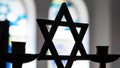 Close up image depicting the Jewish religious symbol of the star of David inside a synagogue. "Why are Jews bad," Google searches have increased 450% since Oct. 7, an SEO expert says. - Fox News