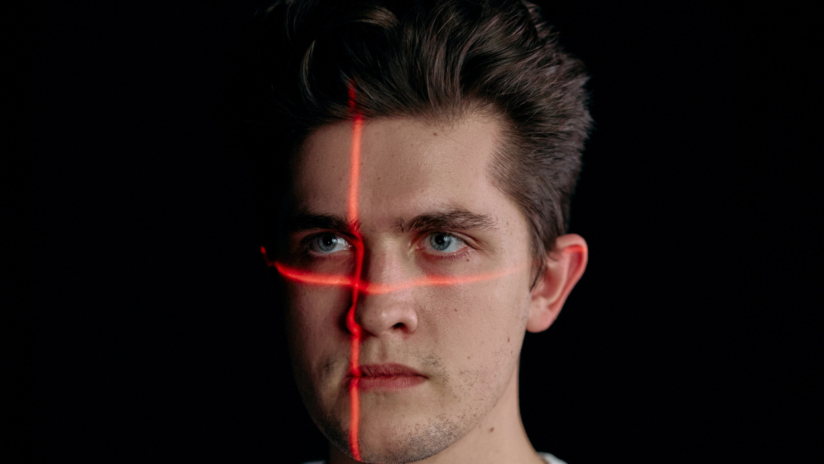 Man with red lights on his face