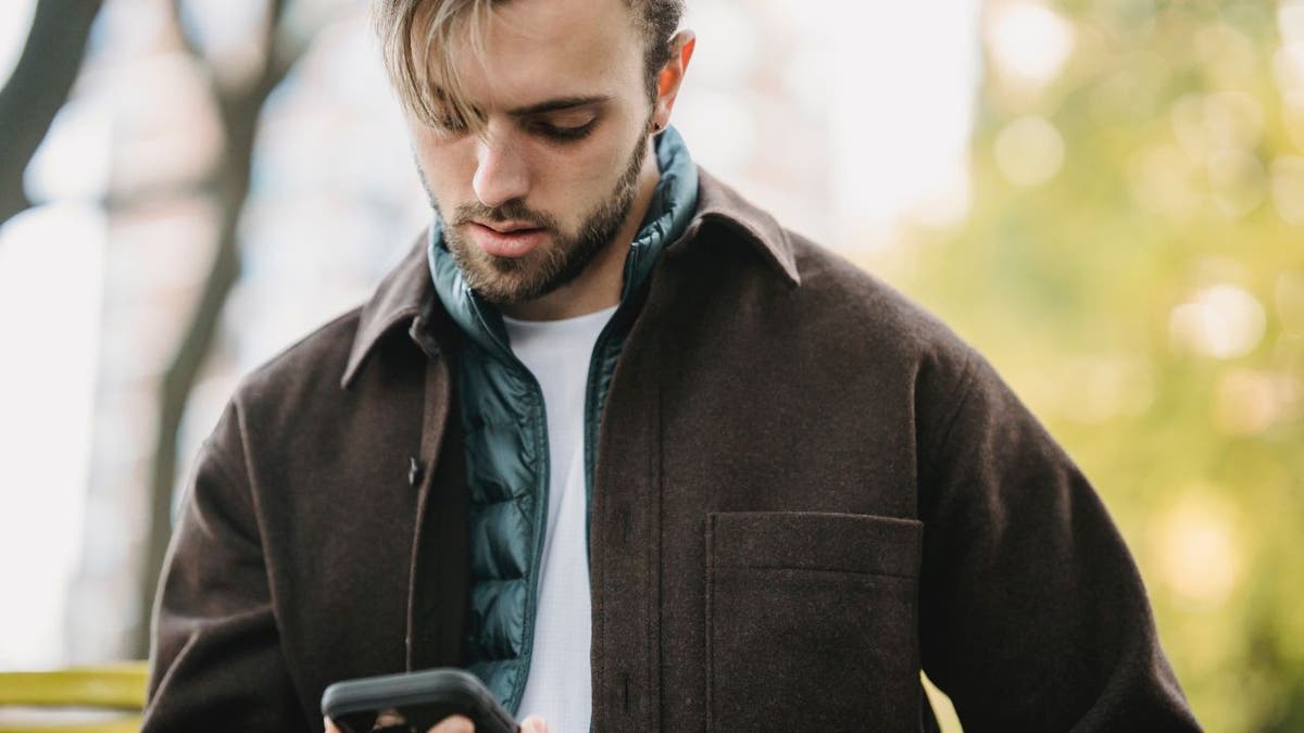 Man looking down at his phone.