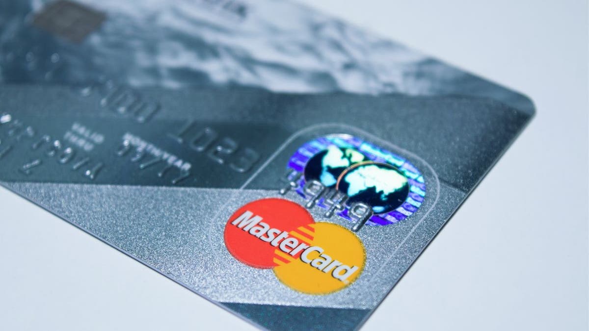 Photo of the MasterCard logo on the front of a credit card.