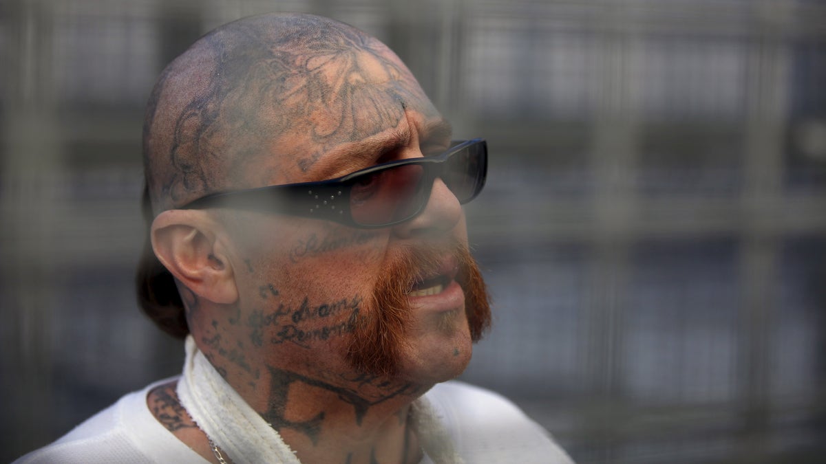 Condemned inmate with face tattoos and mustache