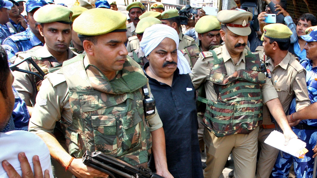 Atiq escorted by police