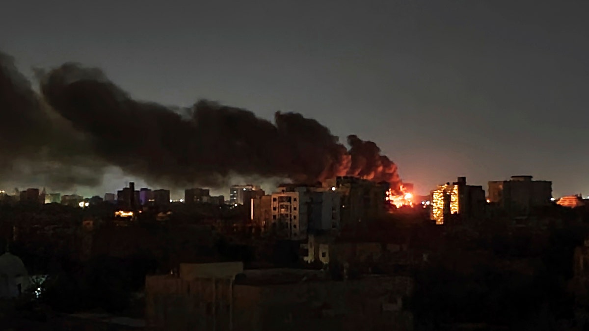 A plume of smoke at night