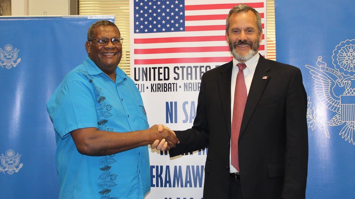 Former U.S. Ambassador to Fiji, Kiribati, Nauru, Tonga, and Tuvalu Joseph Cella (right)