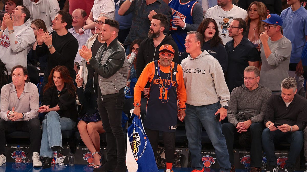 Fans of the New York Knicks cheer on their team