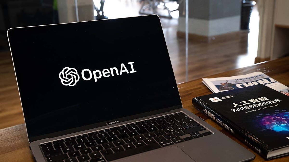 The OpenAI logo arranged on a laptop