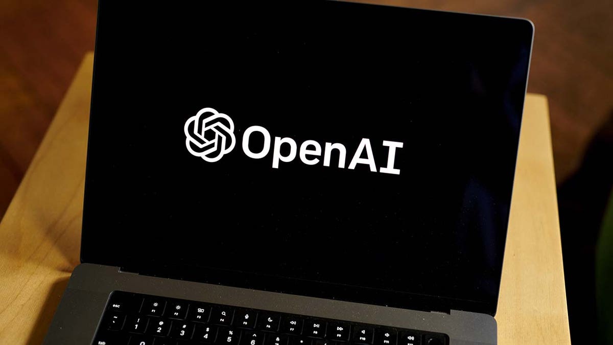 The OpenAI logo on a laptop