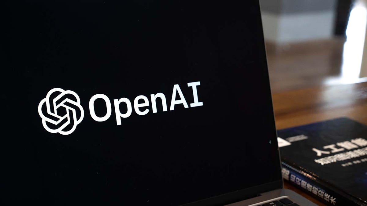 The OpenAI logo arranged on a laptop in Beijing, China, on Friday, Feb. 24, 2023. The rally in Chinese artificial intelligence stocks is showing further signs of cooling amid media reports of authorities banning access to OpenAI's ChatGPT service.?