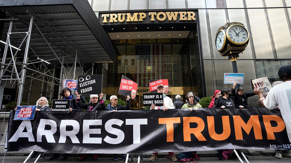 Arrest Trump sign outside Trump Tower