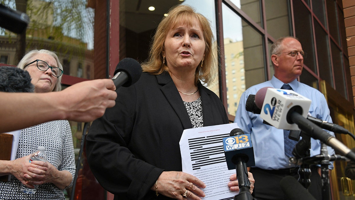 Teresa Lancaster with reporters