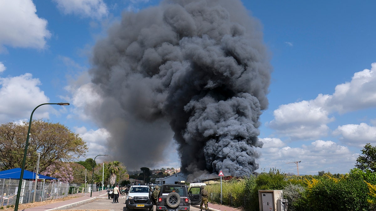 A large plume of dark smoke