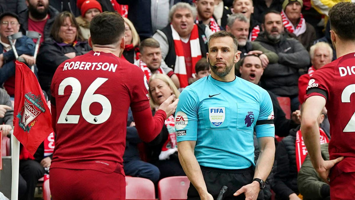 Liverpool's Andrew Robertson appeals to an assistant referee