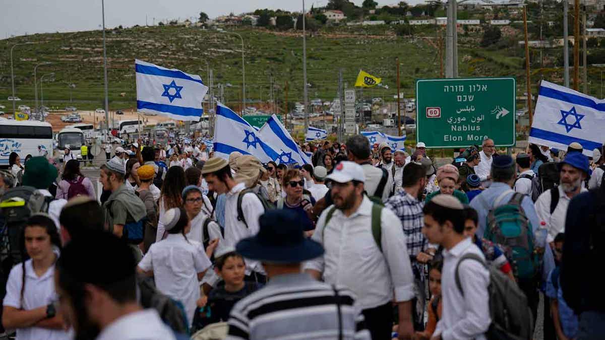 People with flags in the West Bank