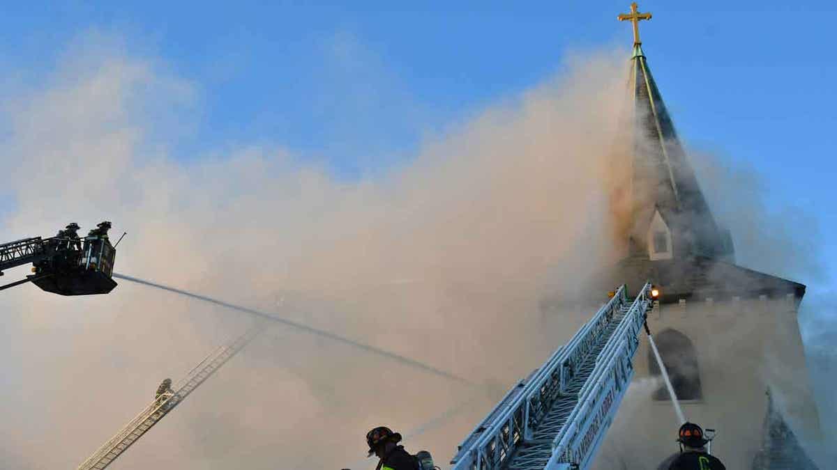 Firefighters putting out church fire