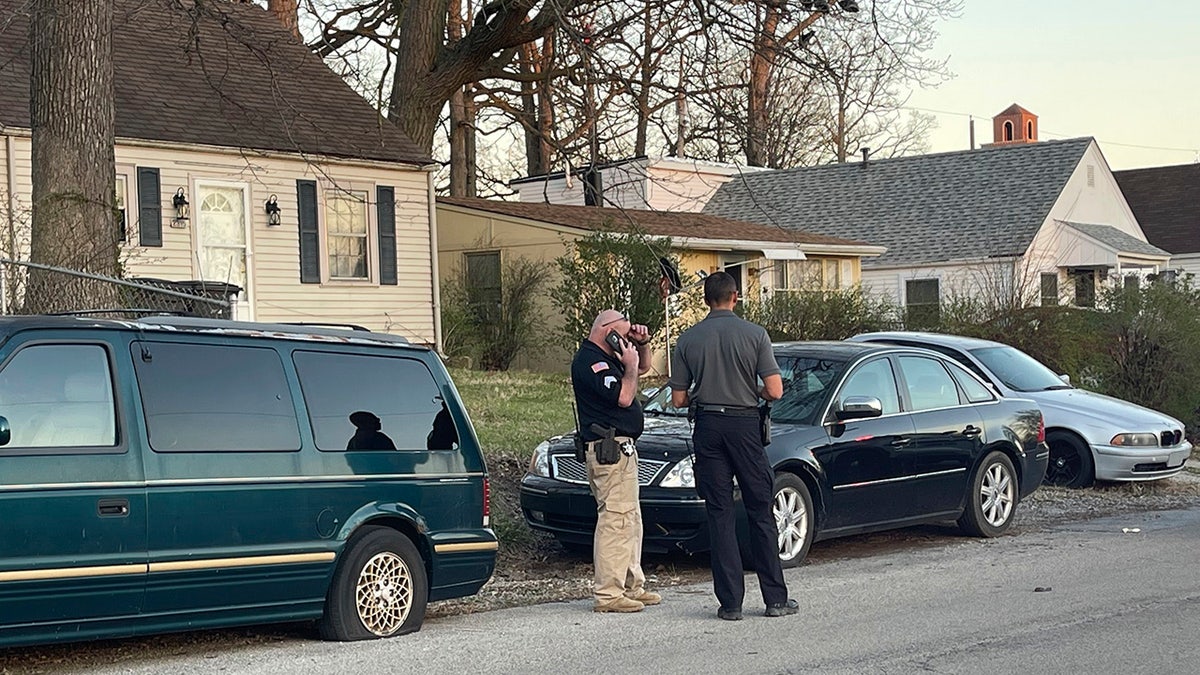 Police officers on scene after a shooting erupted at a park memorial