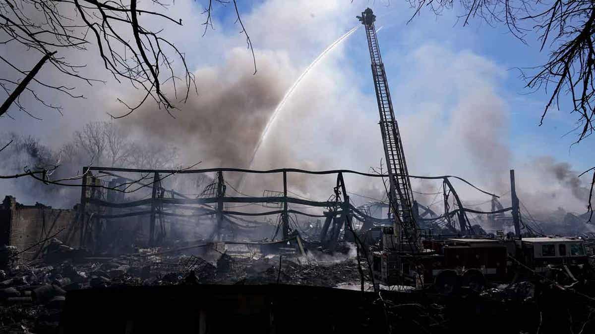 Firefighters pour water 