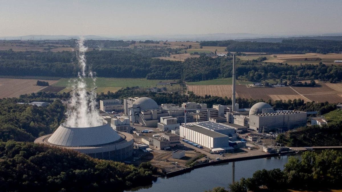 FILE - Water vapor rises from the cooling tower of nuclear power plant of Neckarwestheim II in Neckarwestheim, Germany, Aug. 22, 2022.