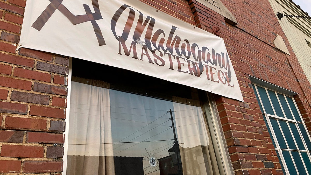 Sign and bullet hole in Dadeville dance hall