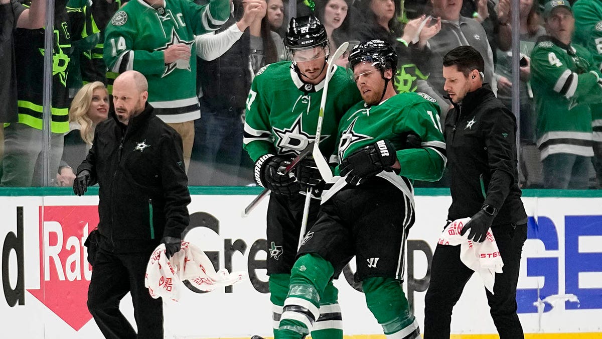 Dallas Stars' Joe Pavelski is helped off the ice during game one of the Stanley Cup playoffs