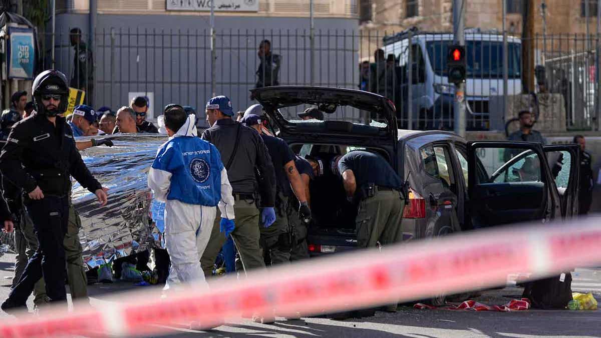 Israeli police examine the scene of a car ramming attack