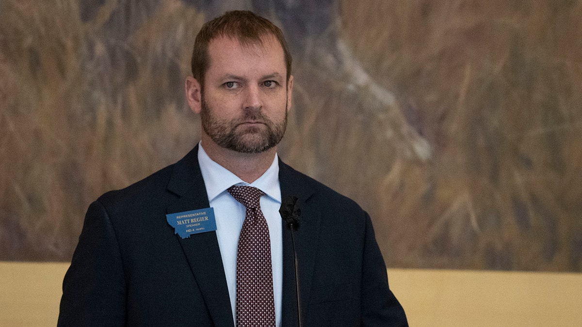 Matt Regier wearing a suit and tie