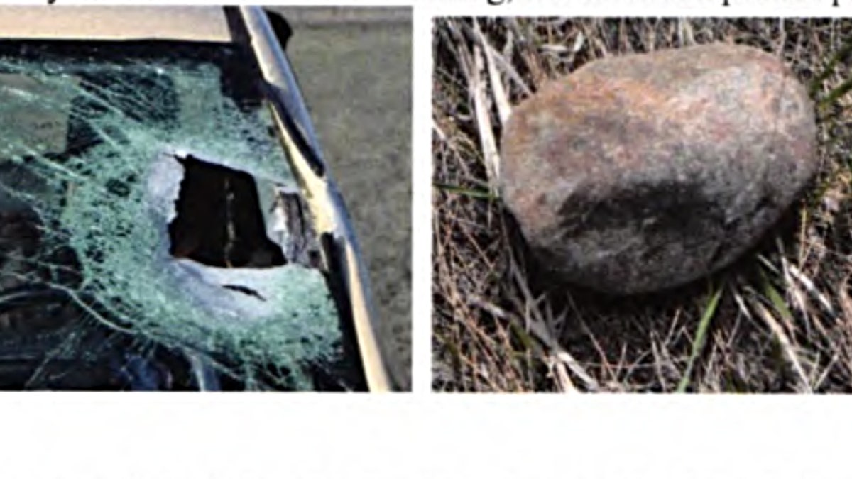 Alexa Bartell's damaged car and a landscaping rock