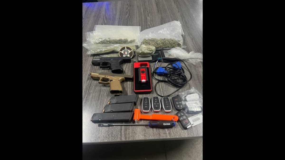 guns and drugs on evidence table