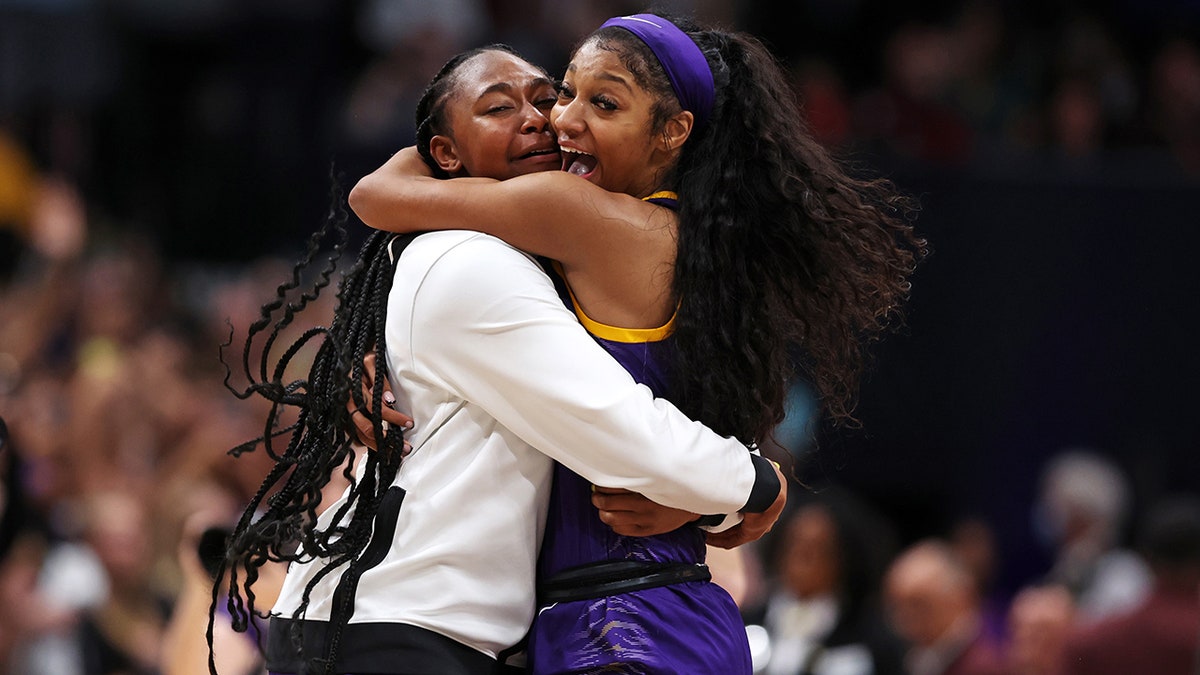 Angel Reese celebrates with her teammate