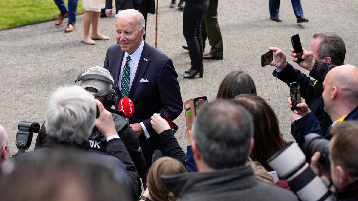 President Biden walks by press in Ireland
