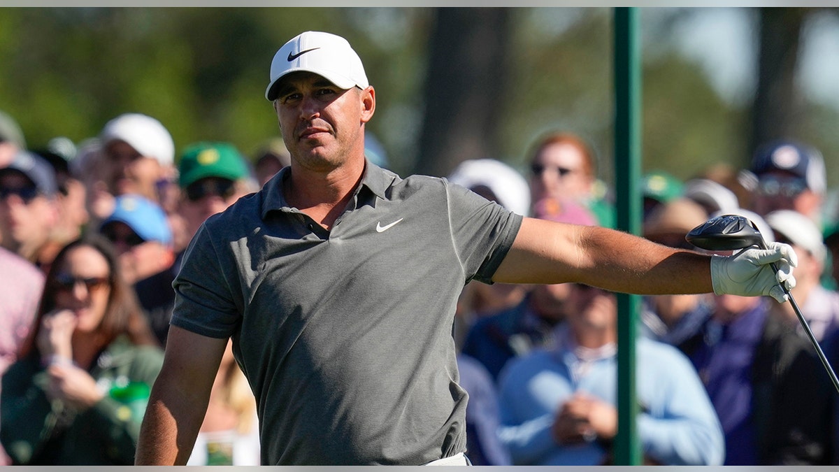 Brooks Koepka looks at tee shot