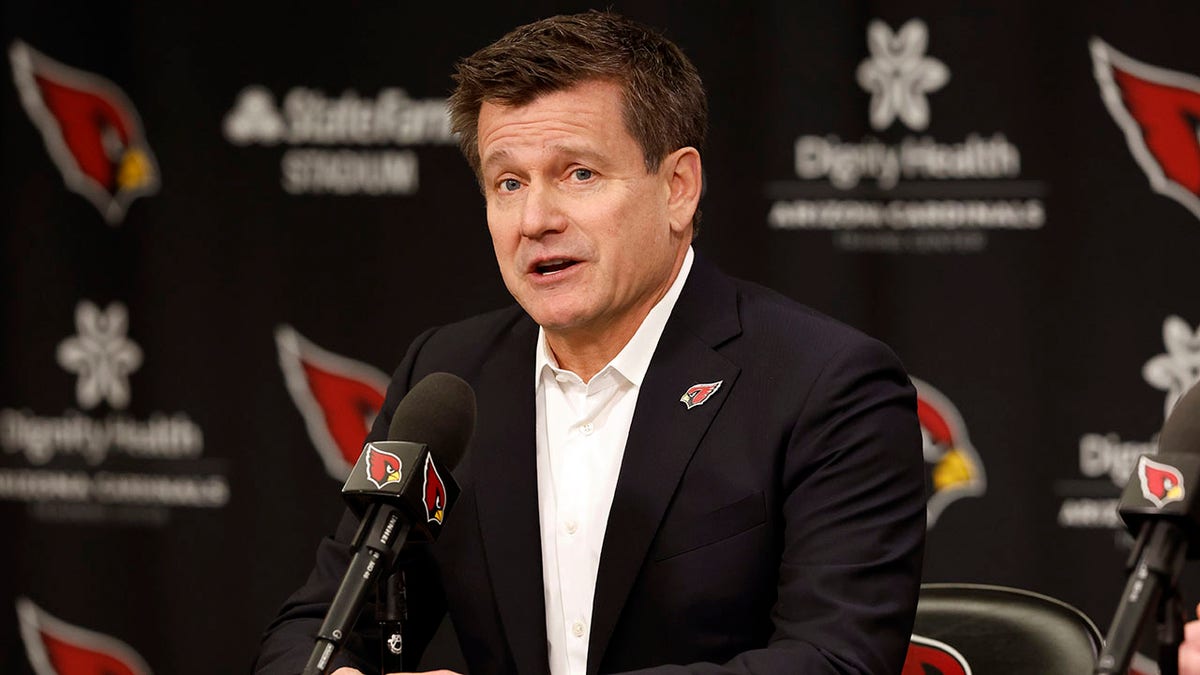 Michael Bidwill talks during a press conference