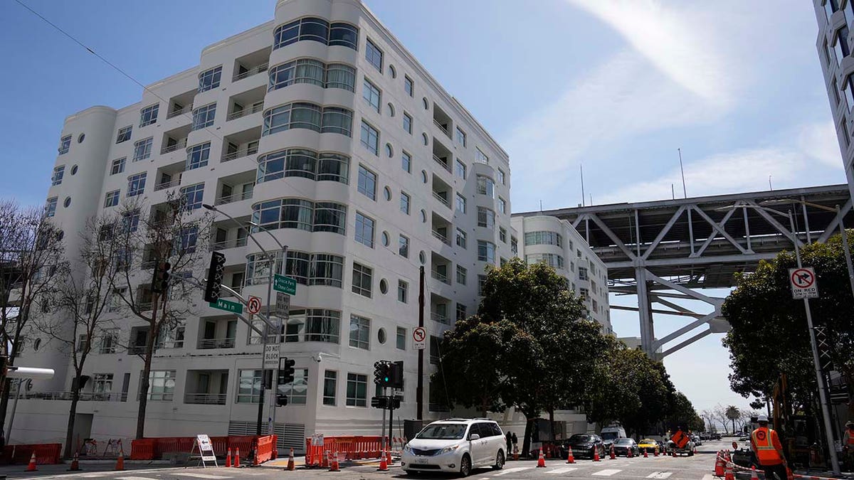 Shown is the scene outside an apartment building below the San Francisco-Oakland Bay Bridge where a technology executive was fatally stabbed