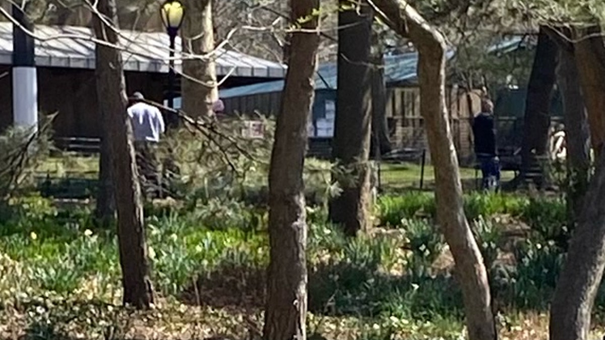 Man in gray sweatshirt walks away