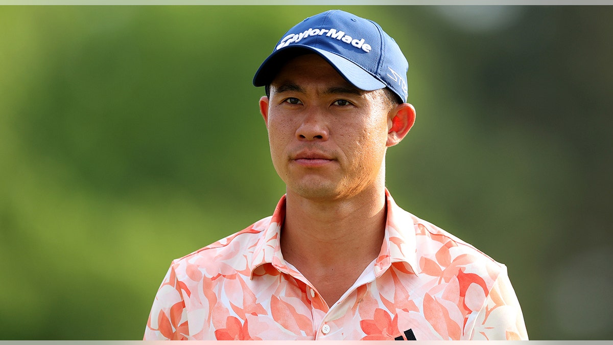 Collin Morikawa looks on golf course