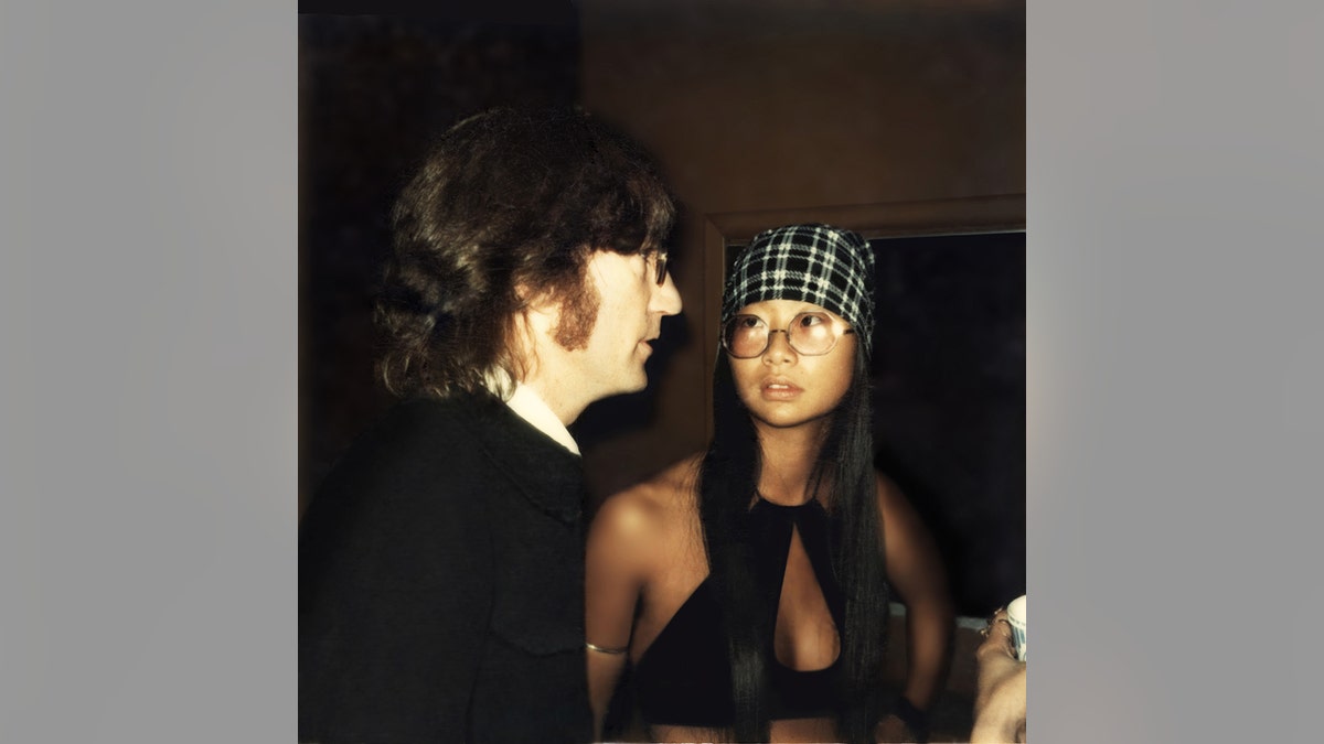 John Lennon and May Pang looking at each other during a night out