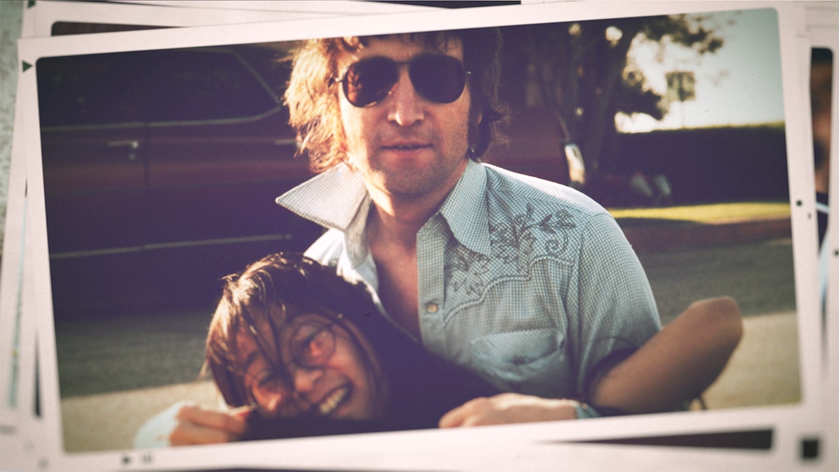 John Lennon embracing May Pang during a picnic